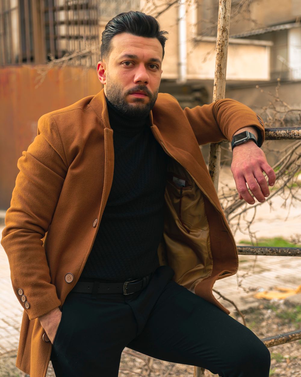 Model wearing a camel wool coat from the Autumn / Winter 2026 collection